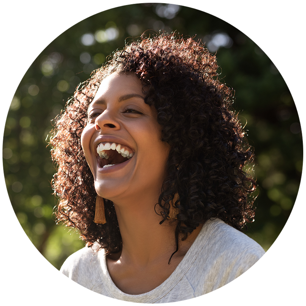 a photo of a woman outside laughing