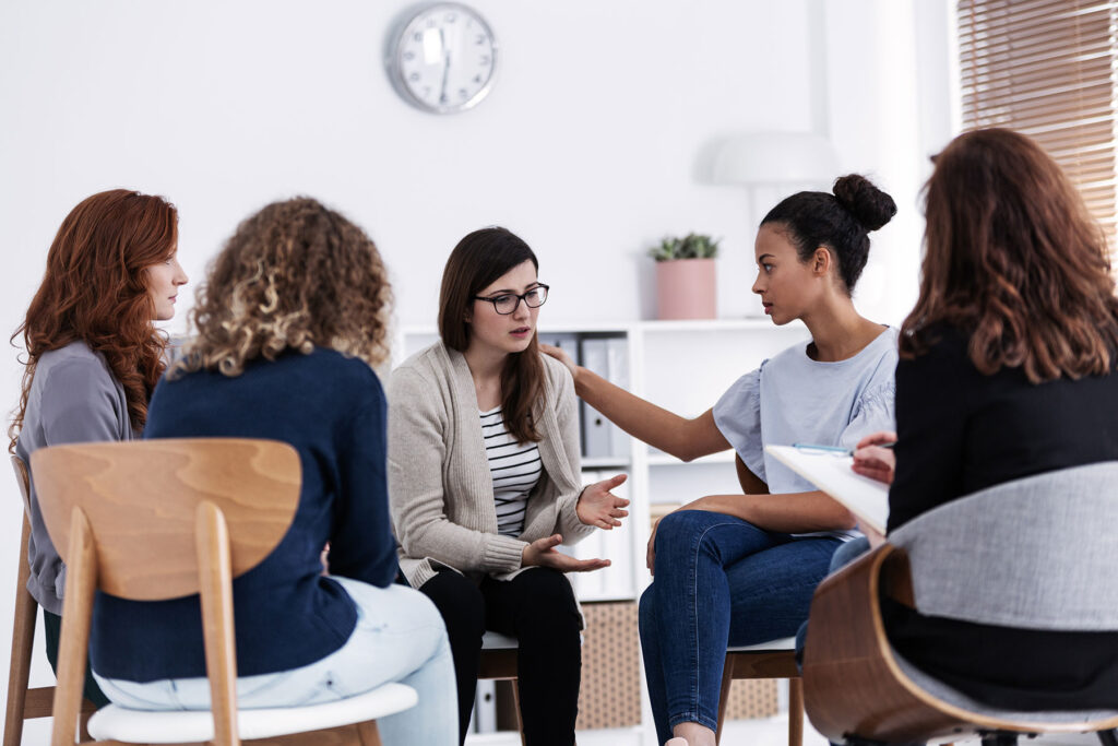 a group in therapy discuss the ability to work while in a women's program