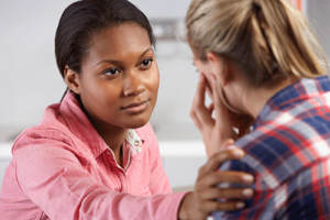 a therapist comforts a client during anxiety treatment