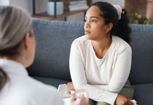 a person in cbt for psychosis listens to a therapist