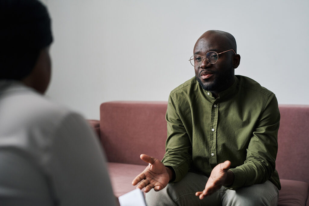 Man hearing about therapy for caregivers