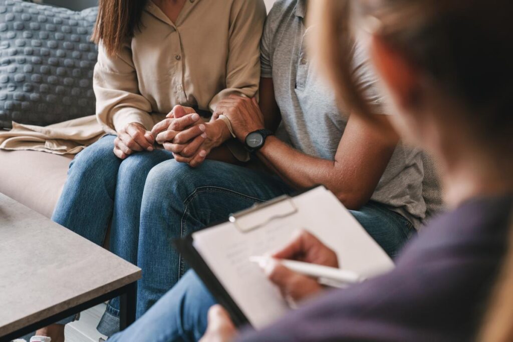 Image of someone helping a loved one with anxiety