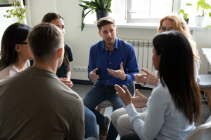 A group of people in group therapy