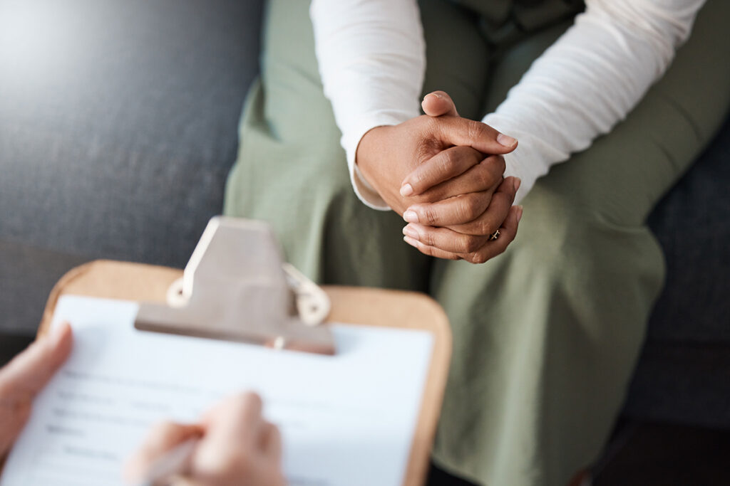 a person listens to a therapist after asking can ptsd be treated?