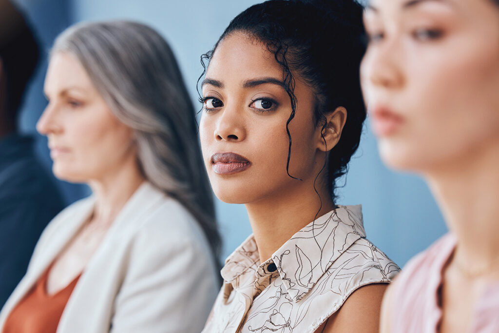 a woman in line looks at the camera