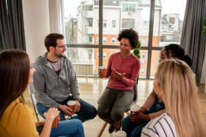 an anxiety therapist in quincy ma leads a therapy group session