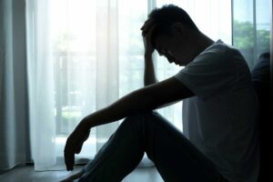 a man struggles to overcome symptoms of depression