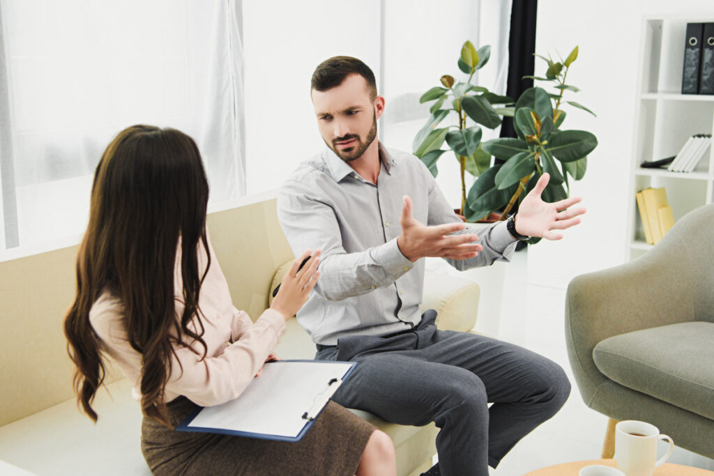 Man speaking to psychiatrist