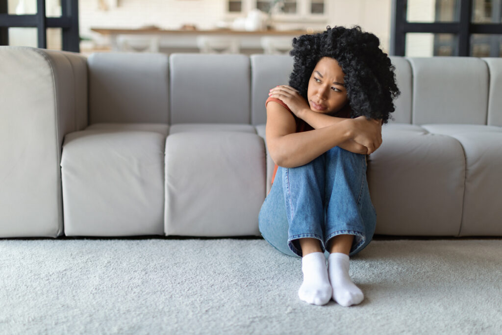 Woman sitting in living room
