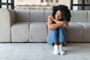 Woman sitting in living room